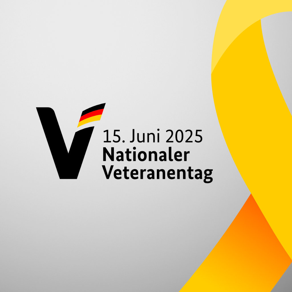 Logo des 1. Nationalen Veteranentages in Deutschland mit einer gelben Schleife rechts daneben.